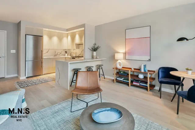 a living room with furniture a dining table and chair with wooden floor