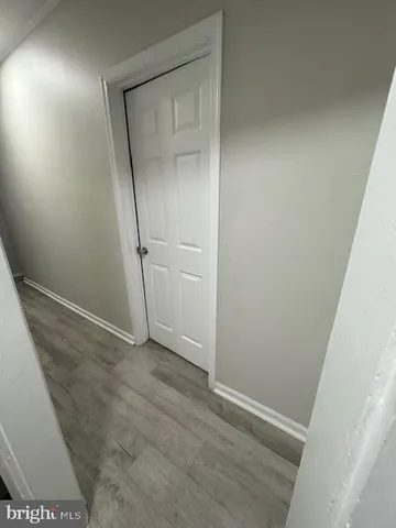 an empty room with wooden door