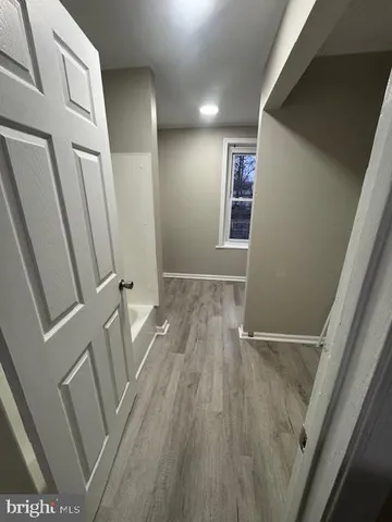 a view of room with window and entryway