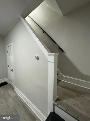 a view of entryway with wooden floor