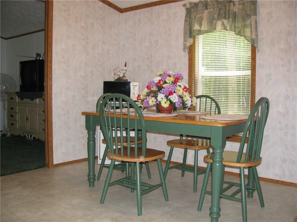 1375 Bucktail Road Jamestown, PA 16134 - Photo 12 of 23 DINING AREA IN KITCHEN. MASTER BEDROOM OFF KITCHEN FOR OPTIMAL PRIVACY