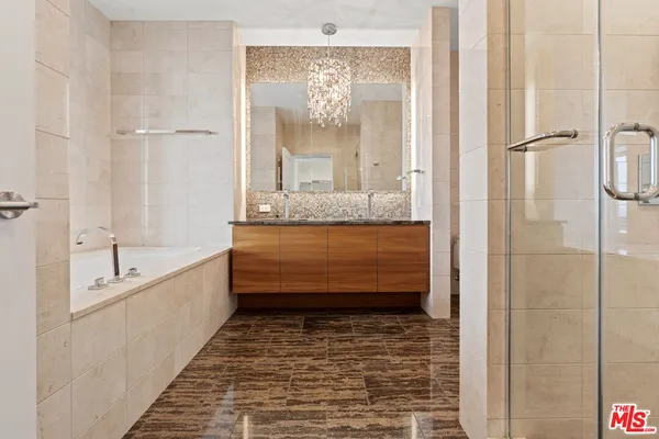a bathroom with a tub and shower
