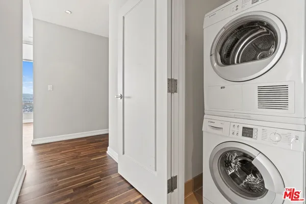 a view of a hallway with washer and dryer