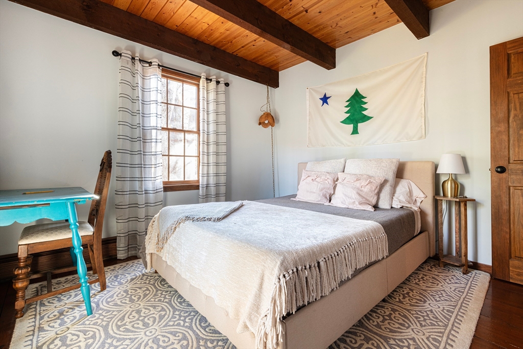 5 June Street Pepperell, MA 01463 - Photo 14 of 31 a bed sitting in a bedroom next to a window