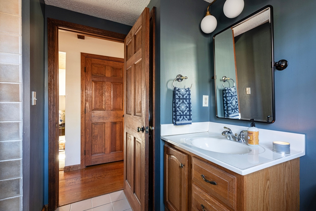 5 June Street Pepperell, MA 01463 - Photo 15 of 31 a bathroom with a sink and a mirror