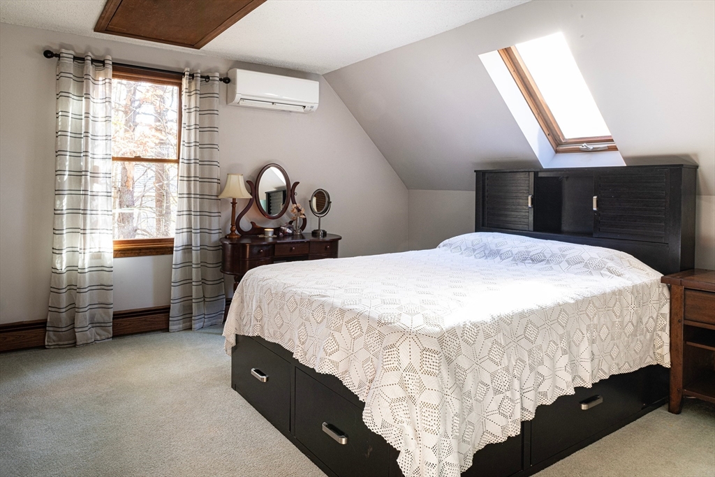 5 June Street Pepperell, MA 01463 - Photo 18 of 31 a bedroom with a bed and a window