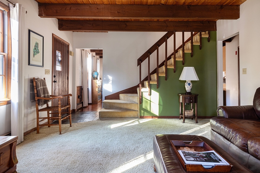 5 June Street Pepperell, MA 01463 - Photo 2 of 31 a living room with furniture and a staircase