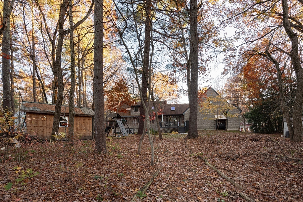 5 June Street Pepperell, MA 01463 - Photo 27 of 31 a backyard of a house with table and chairs