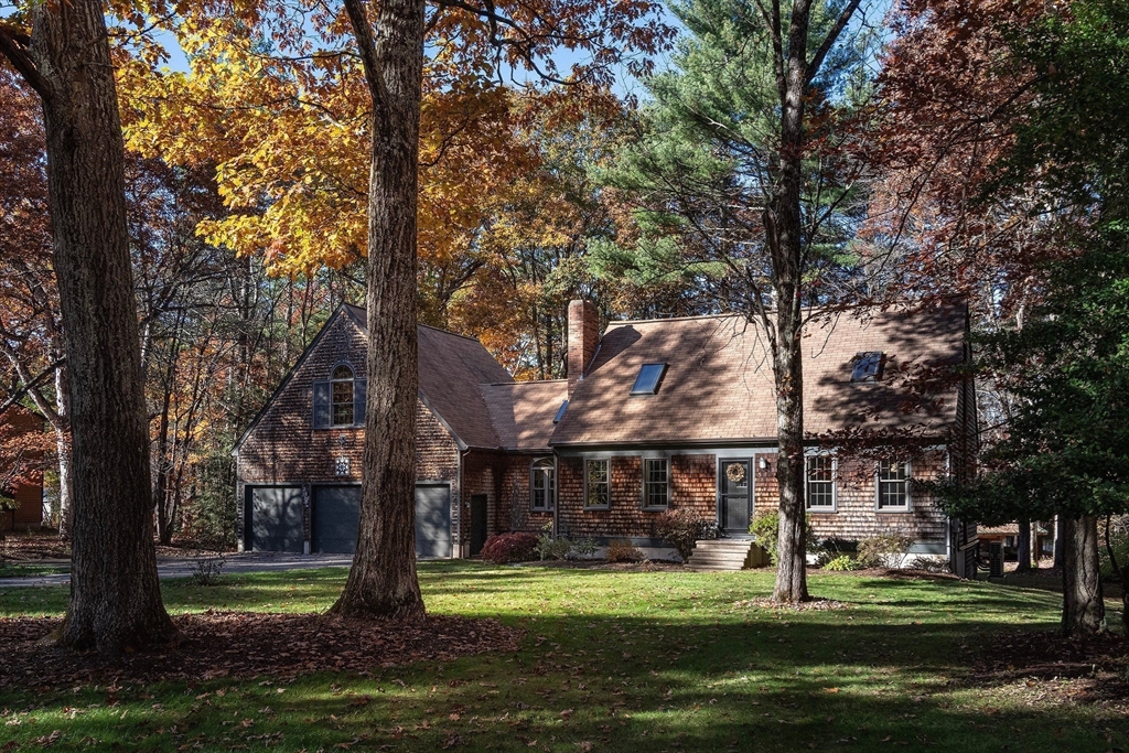 5 June Street Pepperell, MA 01463 - Photo 28 of 31 a front view of a house with a garden and trees