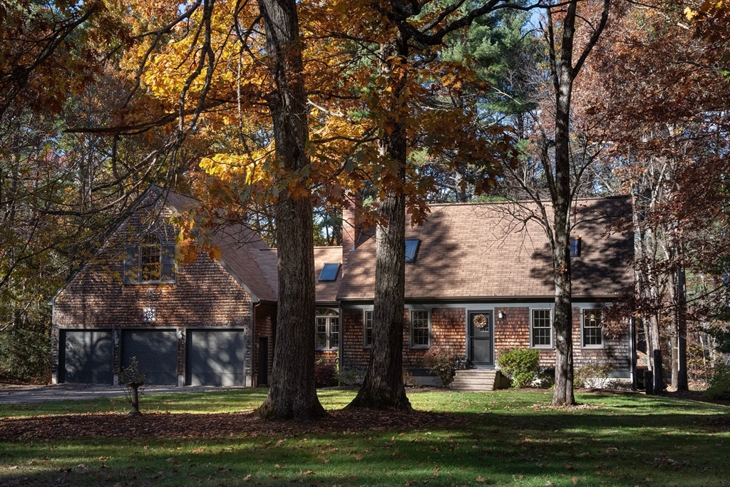5 June Street Pepperell, MA 01463 - Photo 29 of 31 a front view of a house with a garden and tree