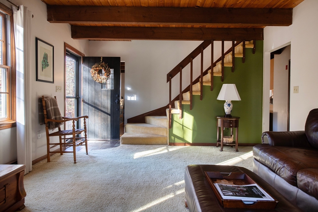 5 June Street Pepperell, MA 01463 - Photo 3 of 31 a living room with furniture and a fireplace