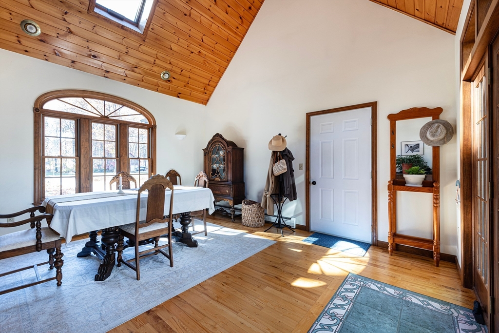 5 June Street Pepperell, MA 01463 - Photo 7 of 31 a living room with furniture a rug potted plant and a large window