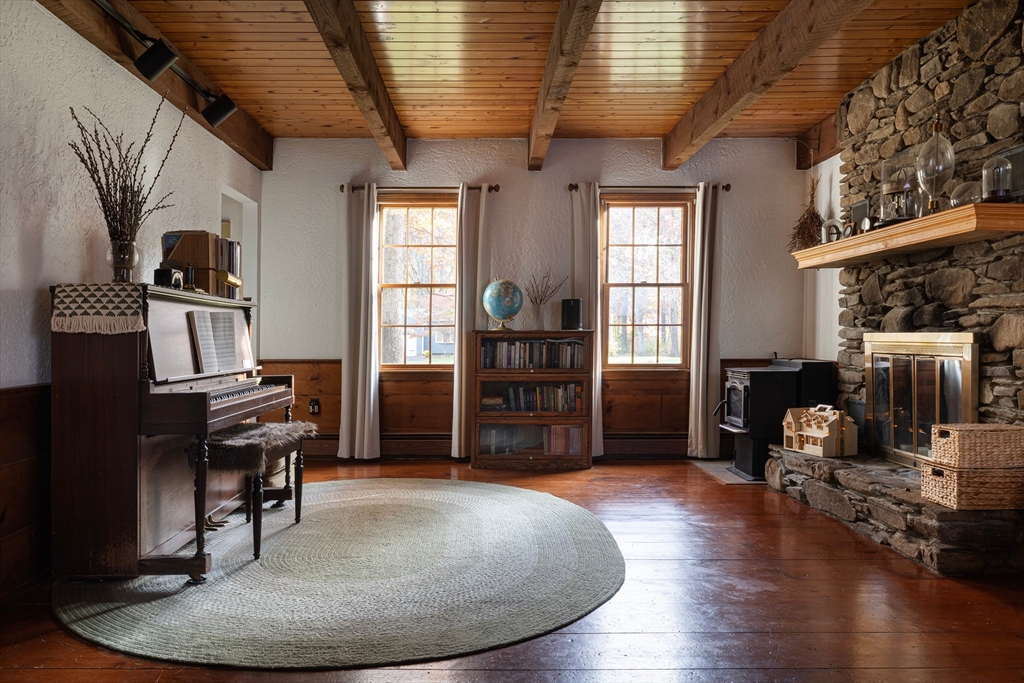 5 June Street Pepperell, MA 01463 - Photo 8 of 31 a view of a livingroom with furniture and a kitchen
