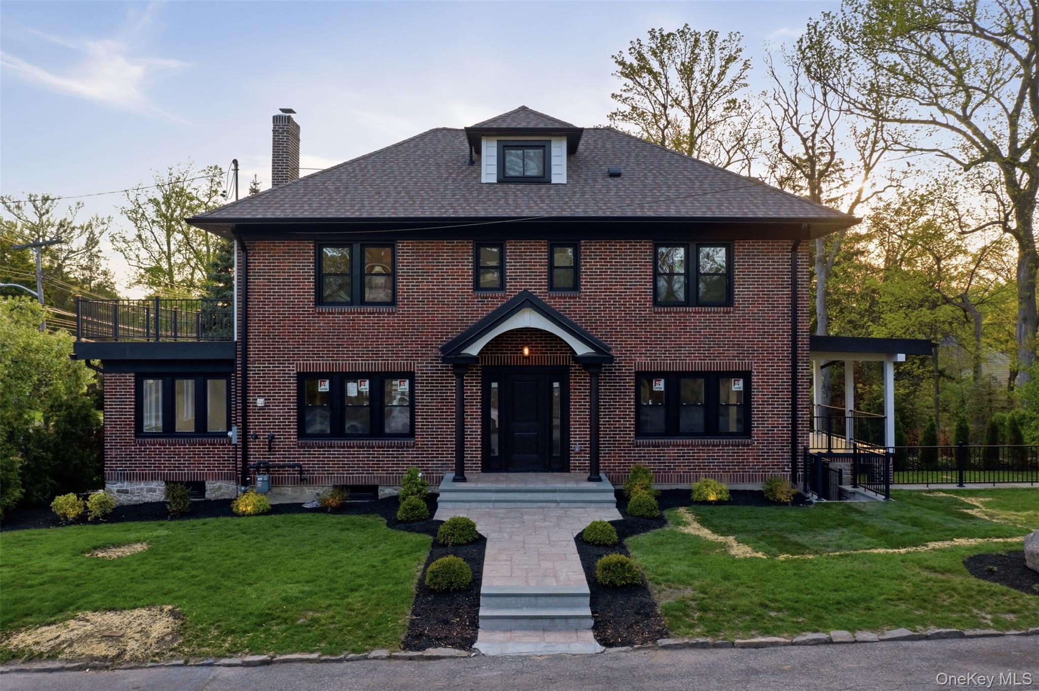 40 Calhoun Avenue New Rochelle, NY 10801 - Photo 2 of 49 Brick exterior residence featuring a welcoming portico entrance