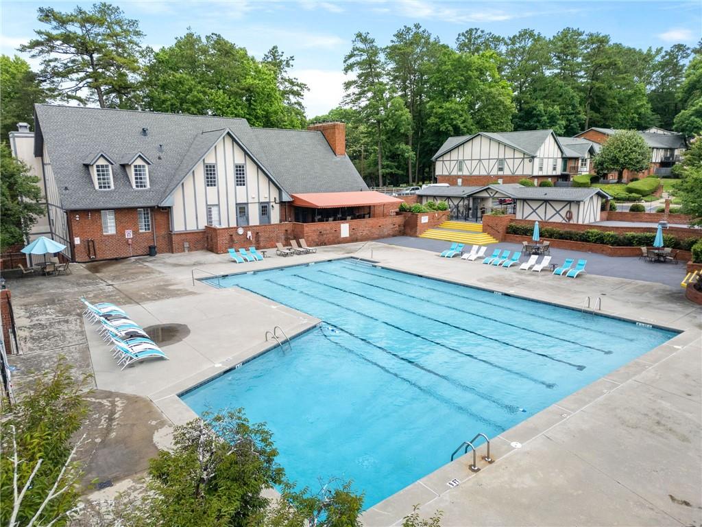 6851 Roswell Road, Unit H26 Atlanta, GA 30328 - Photo 44 of 49 an aerial view of residential houses with yard and swimming pool