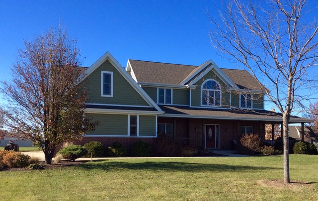 2076 Wiley Ridge Road Kankakee, IL 60901 - Photo 1 of 25 a front view of a house with a garden
