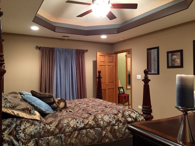 2076 Wiley Ridge Road Kankakee, IL 60901 - Photo 18 of 25 a bed room with a bed and a flat screen tv