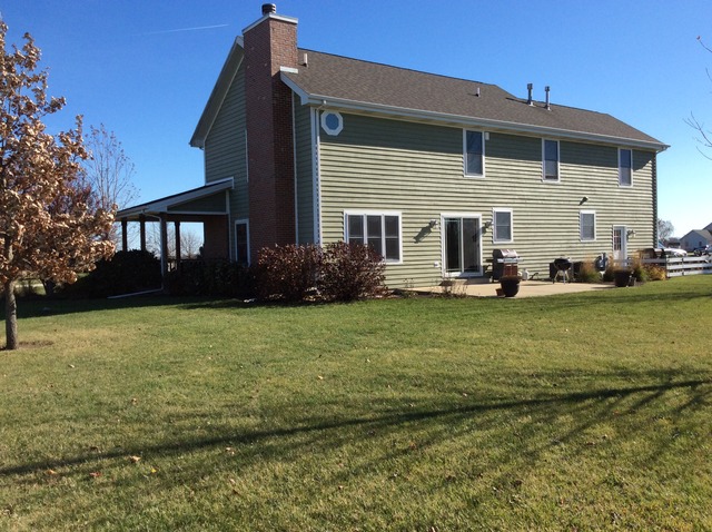 2076 Wiley Ridge Road Kankakee, IL 60901 - Photo 3 of 25 a front view of a house with garden