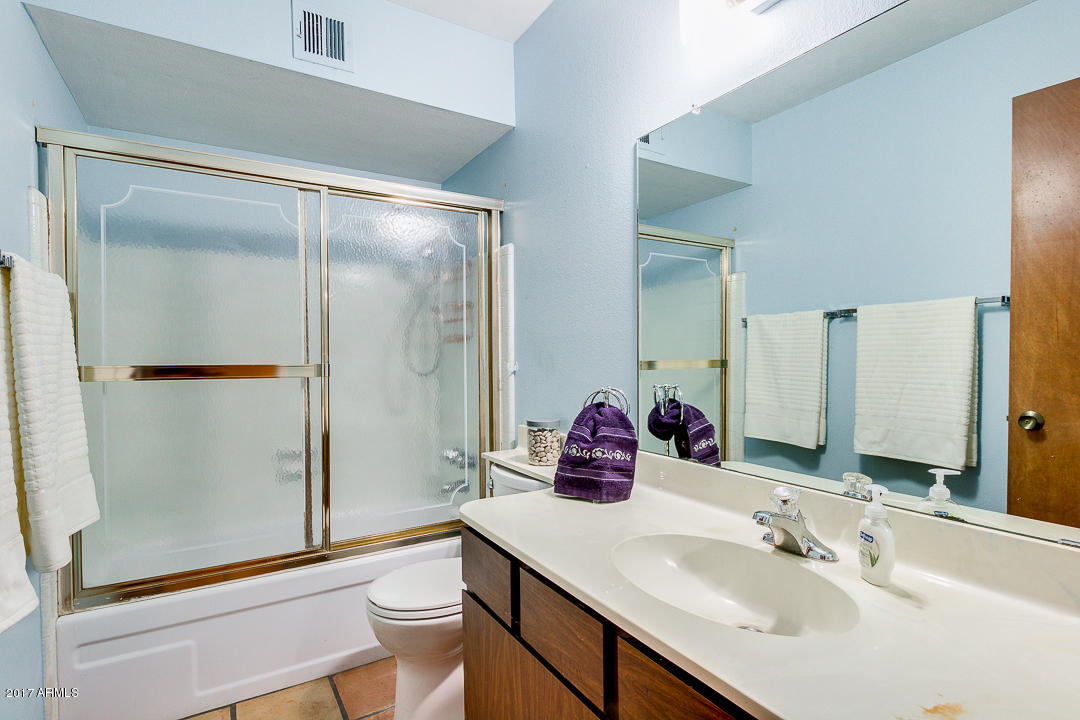 2816 South Evergreen Road Tempe, AZ 85282 - Photo 23 of 38 a bathroom with a sink a toilet and shower