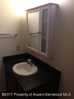 992 Wamsley Way Rifle, CO 81650 - Photo 4 of 10 a bathroom with a sink and a mirror