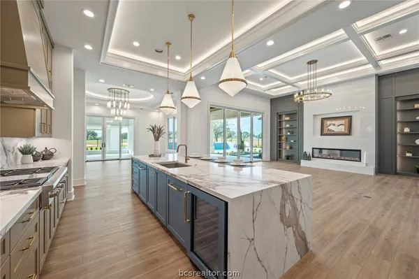 a bathroom with a granite countertop sink a toilet and a mirror