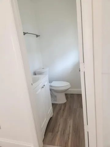 a bathroom with a sink a toilet and a shower