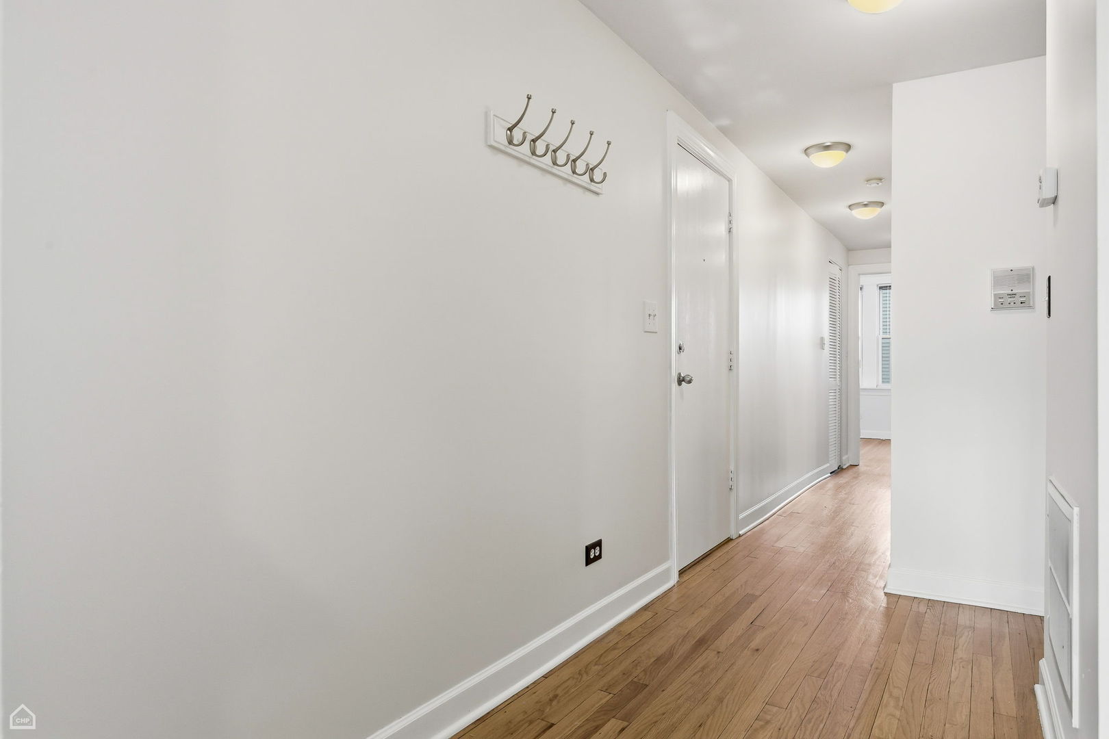 3222 West Berteau Avenue, Unit 2 Chicago, IL 60618 - Photo 12 of 16 a view of an empty room with wooden floor