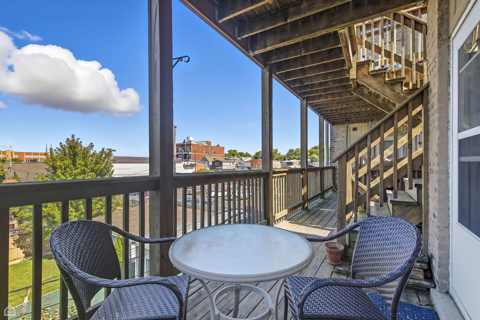 3222 West Berteau Avenue, Unit 2 Chicago, IL 60618 - Photo 15 of 16 a view of a chairs and table in the balcony