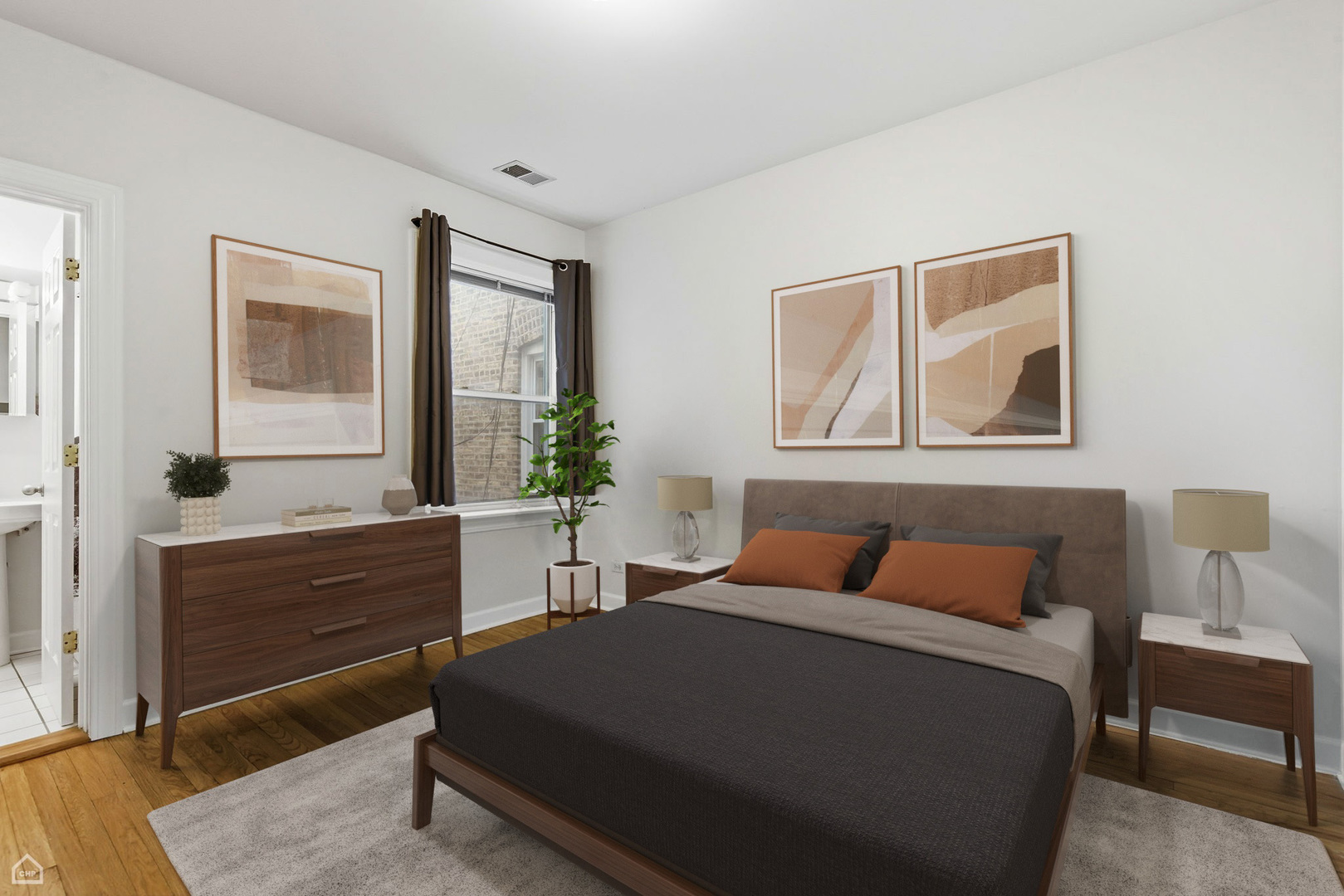 3222 West Berteau Avenue, Unit 2 Chicago, IL 60618 - Photo 4 of 16 a bedroom with a bed and a dresser