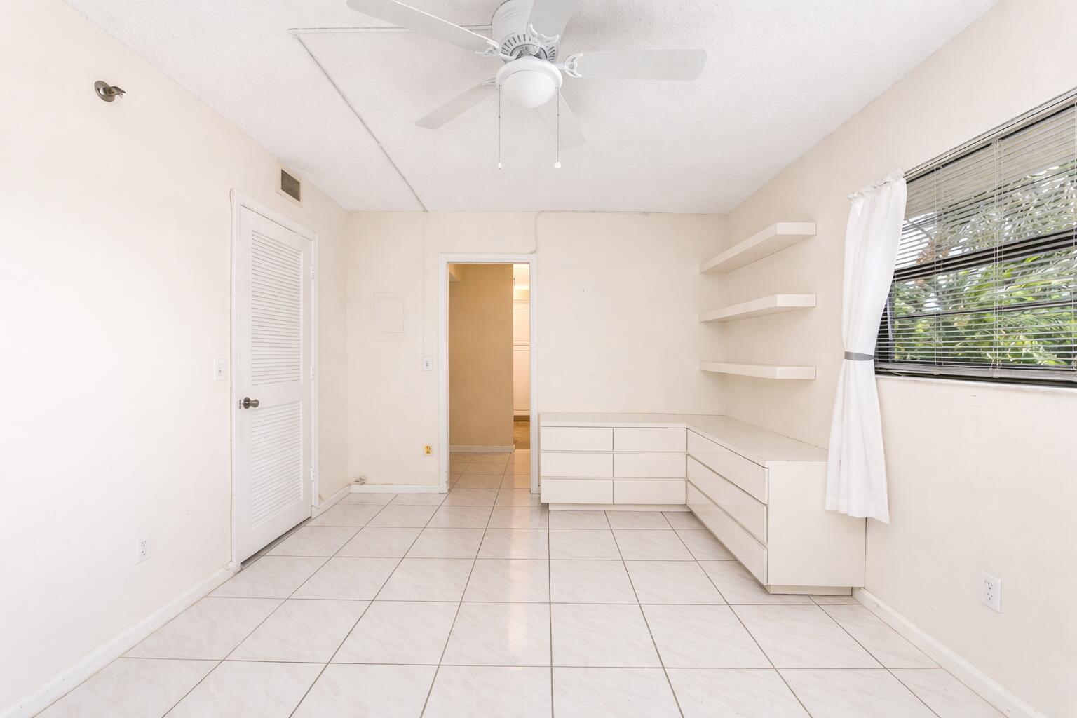 9220 Southwest 14th Street, Unit 3208 Boca Raton, FL 33428 - Photo 11 of 43 a view of an empty room with a window