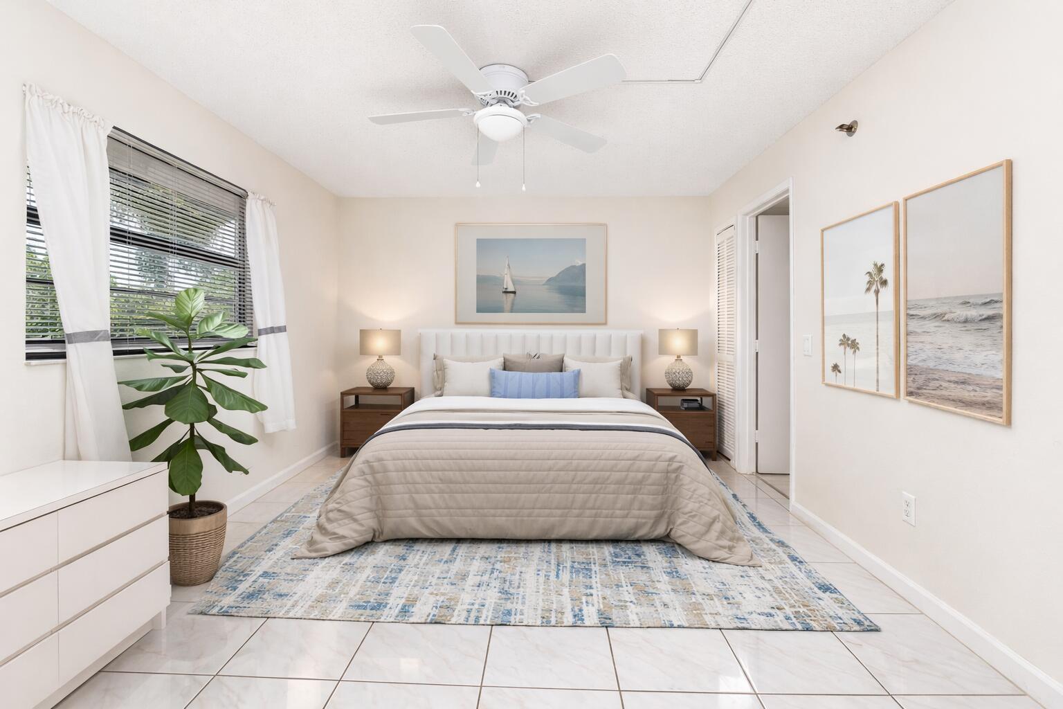 9220 Southwest 14th Street, Unit 3208 Boca Raton, FL 33428 - Photo 13 of 43 a bedroom with a bed and a couch