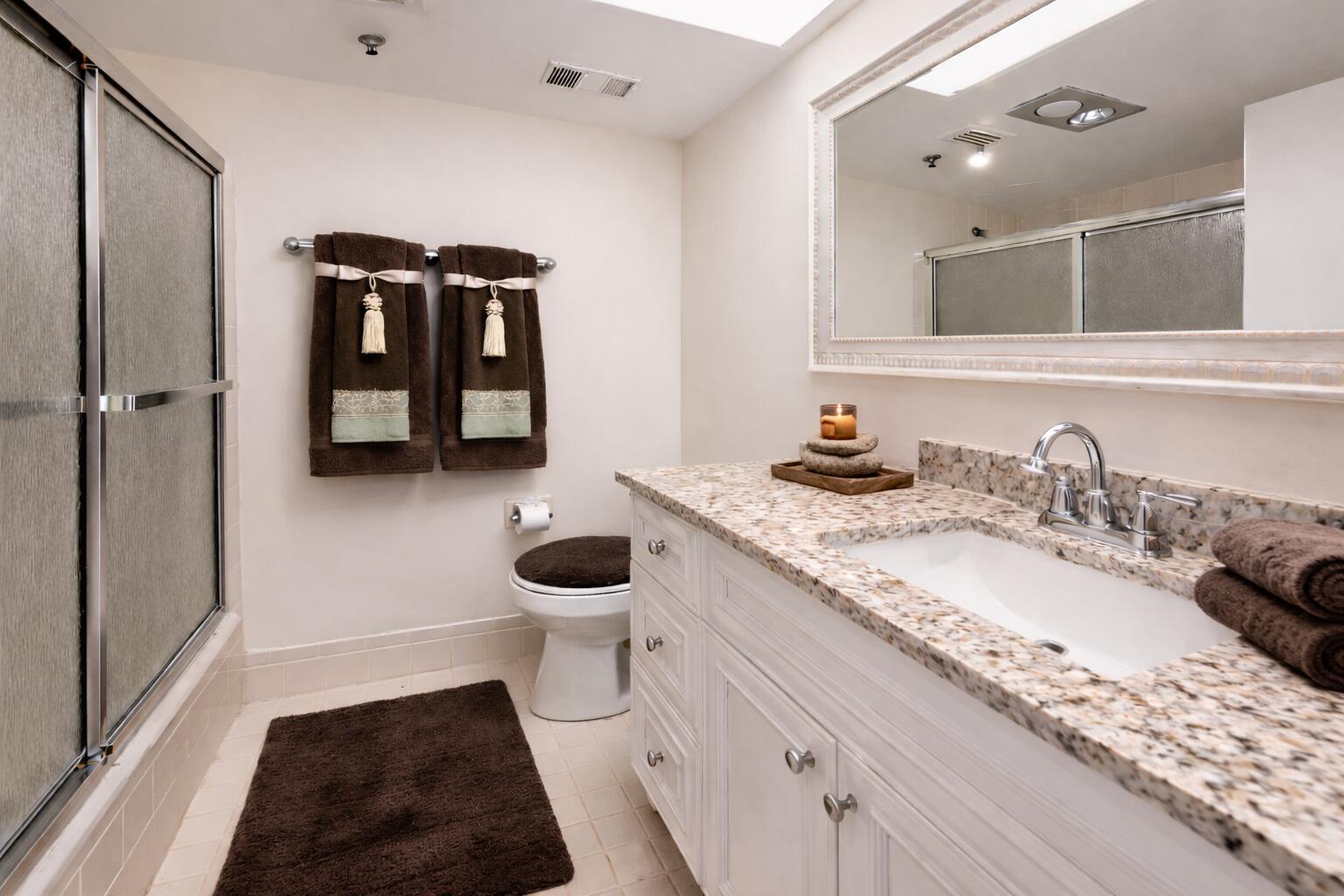 9220 Southwest 14th Street, Unit 3208 Boca Raton, FL 33428 - Photo 18 of 43 a bathroom with a granite countertop sink and a mirror