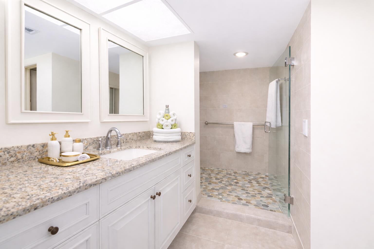9220 Southwest 14th Street, Unit 3208 Boca Raton, FL 33428 - Photo 19 of 43 a bathroom with double sink and a mirror