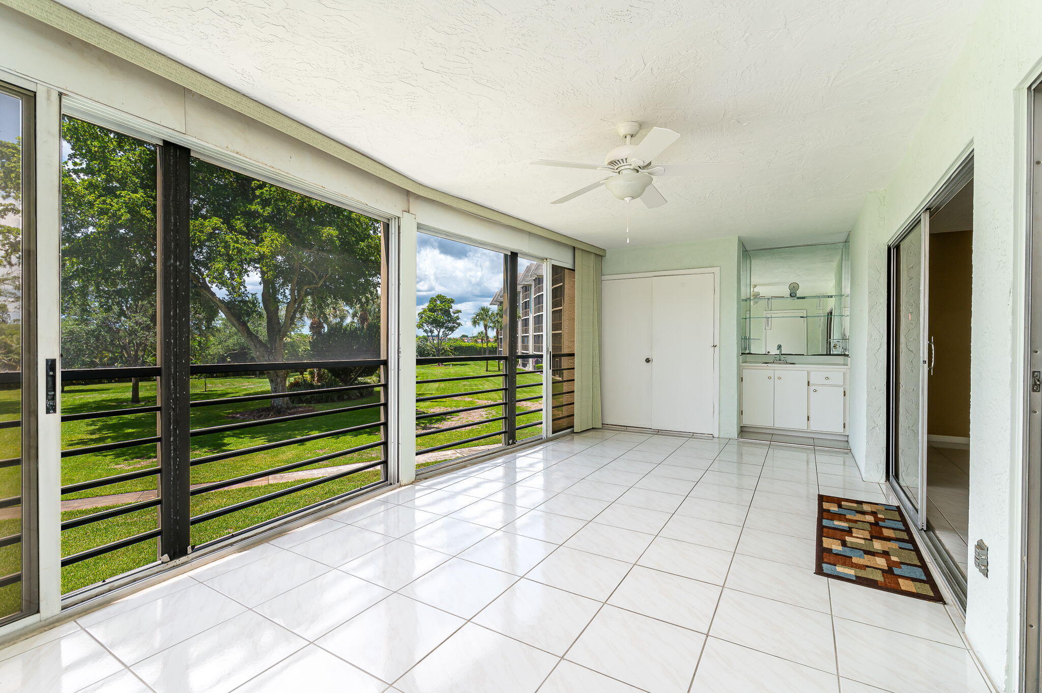 9220 Southwest 14th Street, Unit 3208 Boca Raton, FL 33428 - Photo 23 of 43 a view of empty room with wooden floor and windows