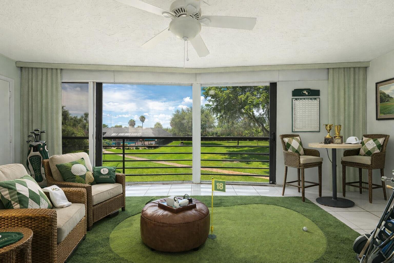 9220 Southwest 14th Street, Unit 3208 Boca Raton, FL 33428 - Photo 24 of 43 a living room with furniture and a floor to ceiling window