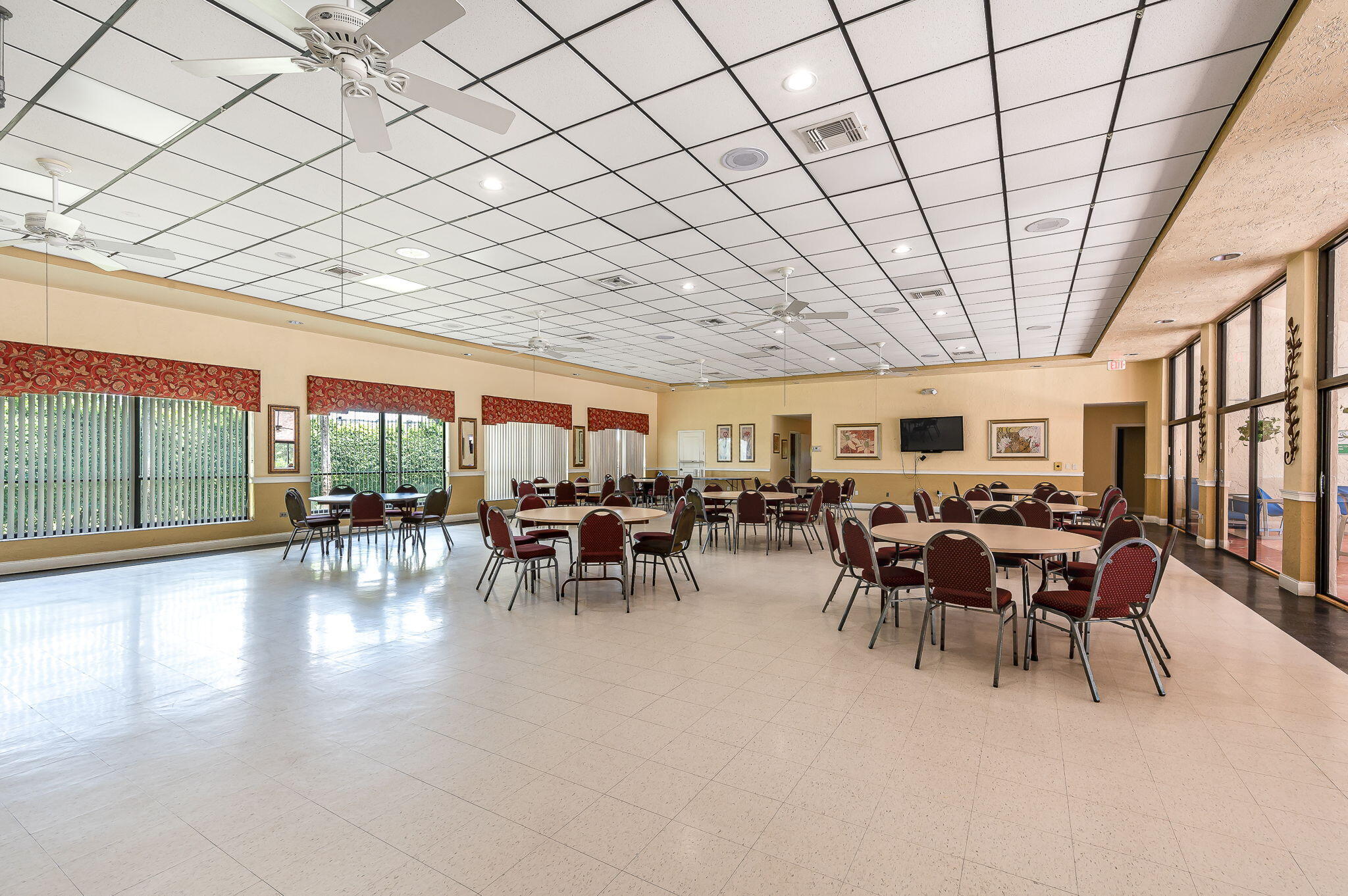 9220 Southwest 14th Street, Unit 3208 Boca Raton, FL 33428 - Photo 33 of 43 a dining hall with furniture and a large window