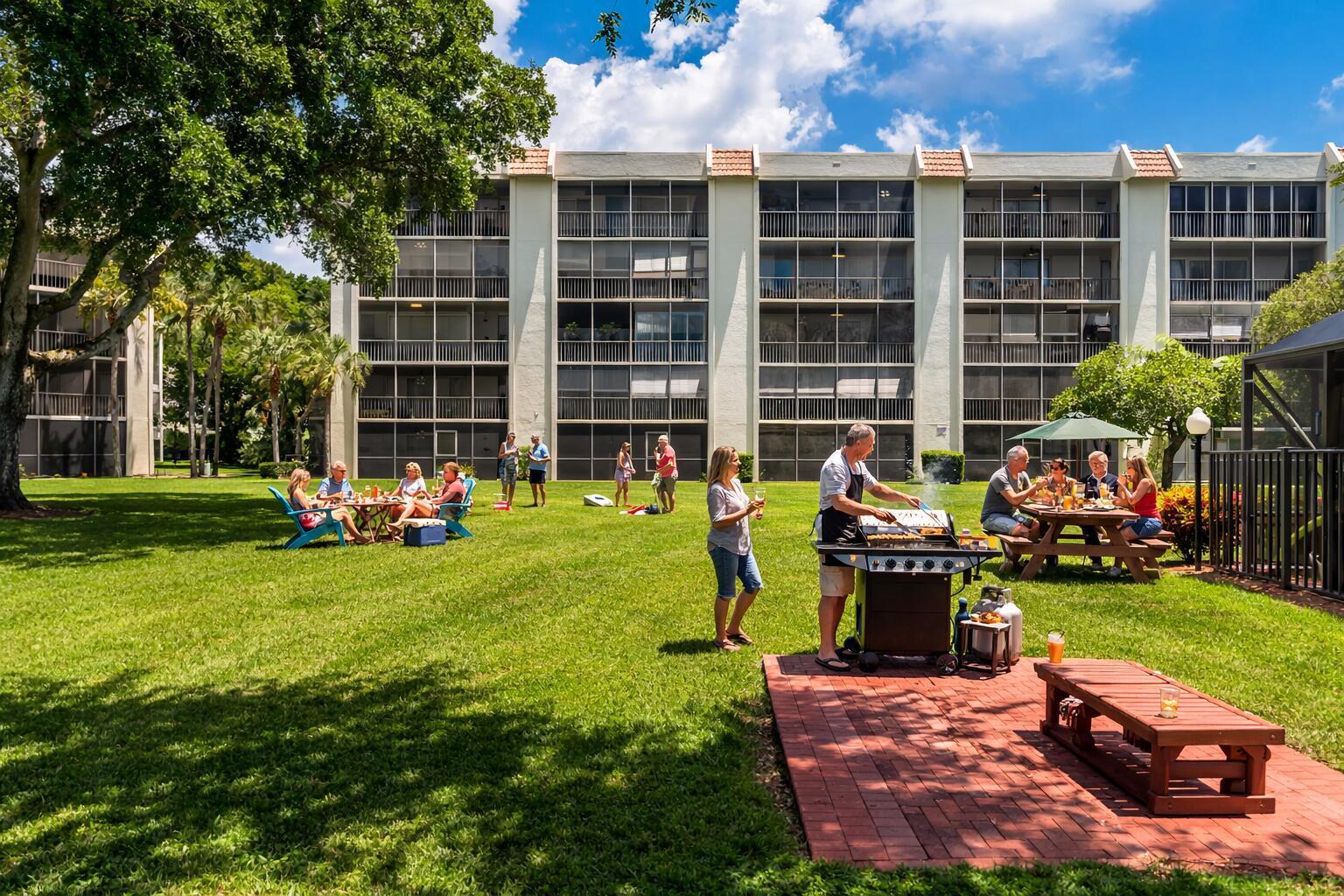 9220 Southwest 14th Street, Unit 3208 Boca Raton, FL 33428 - Photo 39 of 43 a front view of a house with garden and sitting area