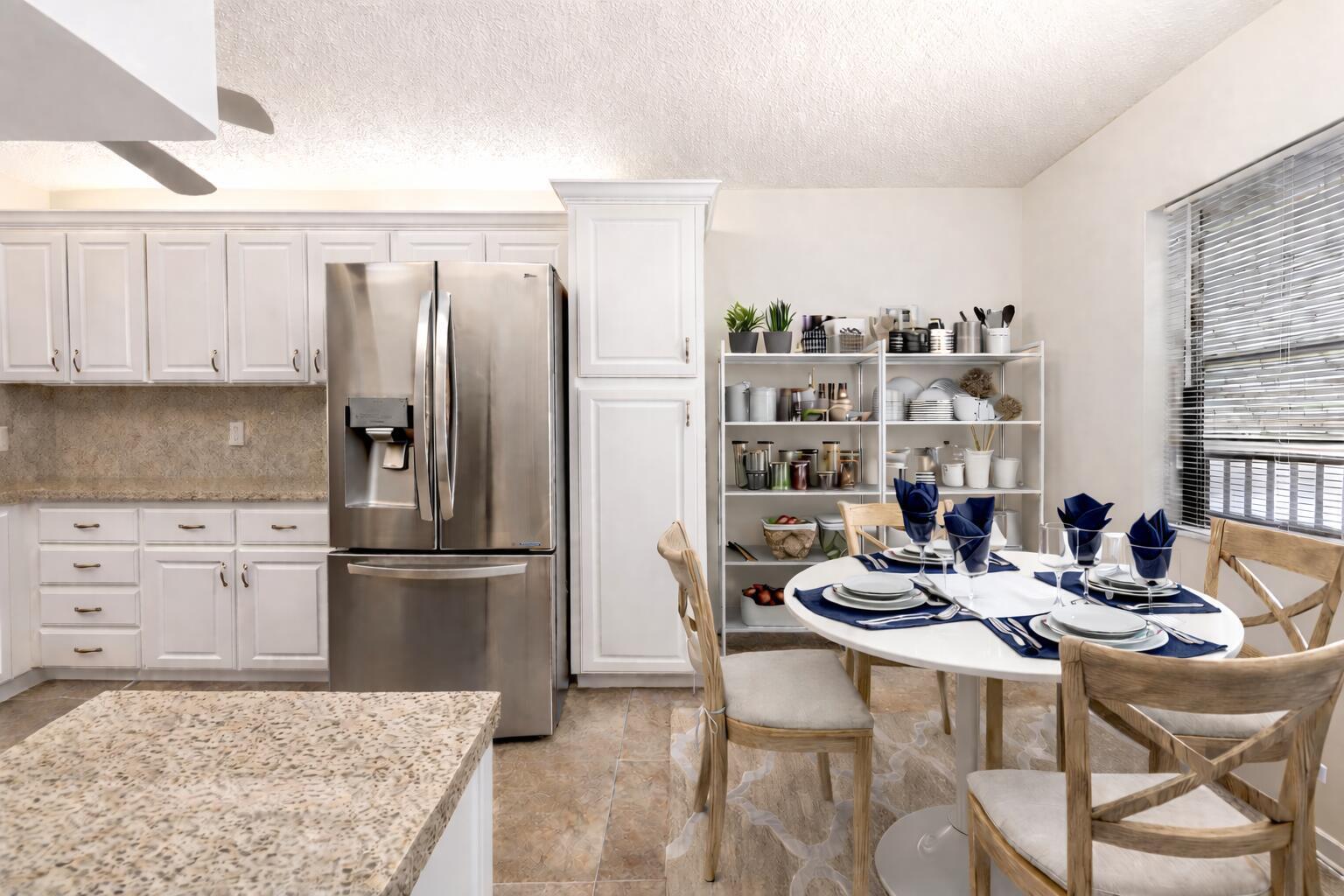 9220 Southwest 14th Street, Unit 3208 Boca Raton, FL 33428 - Photo 9 of 43 a kitchen with a refrigerator and cabinets