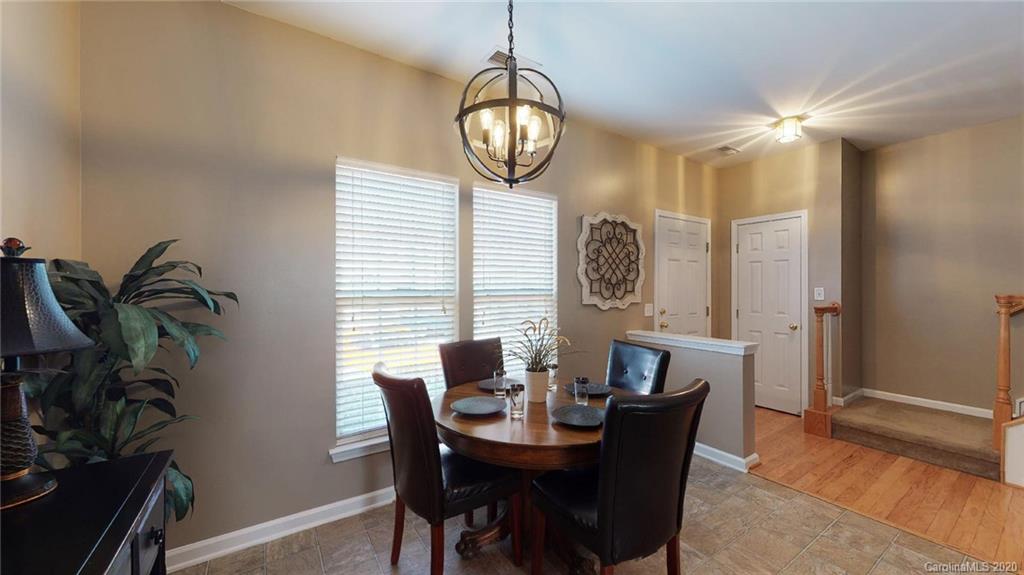 844 Dillard Road Rock Hill, SC 29730 - Photo 12 of 33 a view of a dining room with furniture window and wooden floor