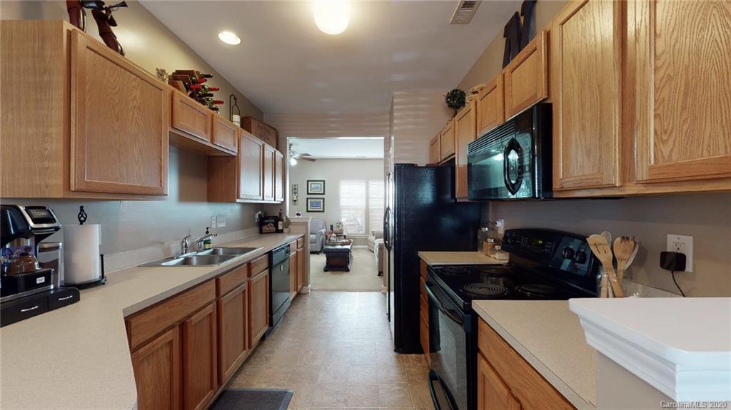 844 Dillard Road Rock Hill, SC 29730 - Photo 13 of 33 a kitchen with stainless steel appliances a sink a stove and cabinets