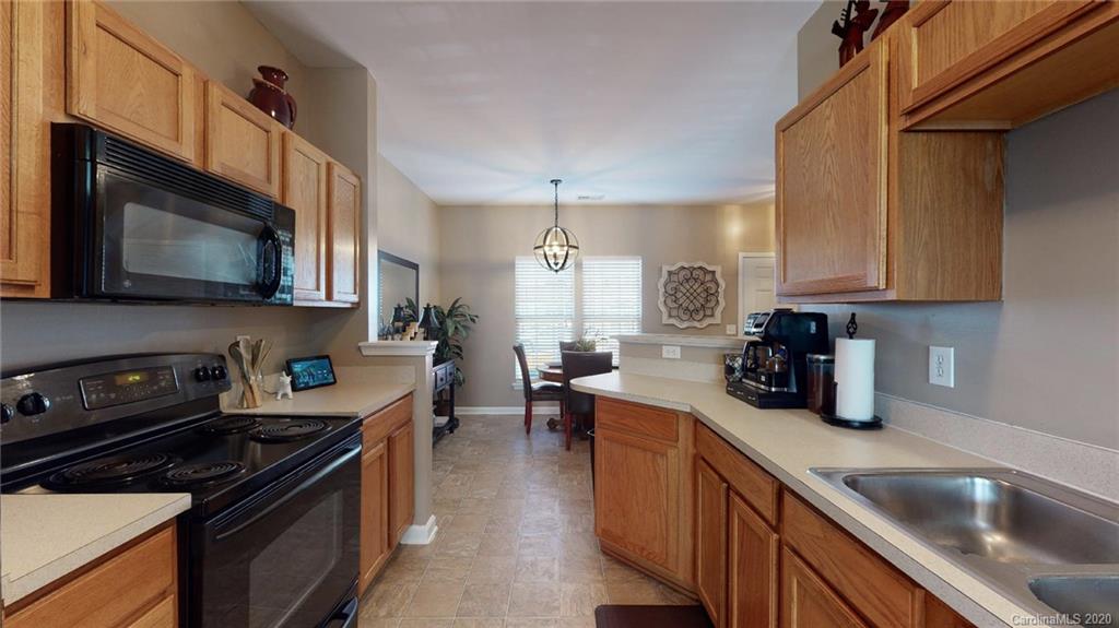 844 Dillard Road Rock Hill, SC 29730 - Photo 15 of 33 a kitchen with a sink a stove and cabinets