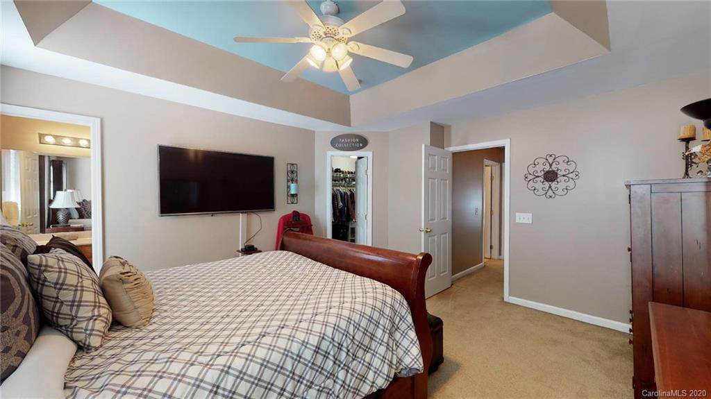 844 Dillard Road Rock Hill, SC 29730 - Photo 23 of 33 a bedroom with a bed and a flat screen tv