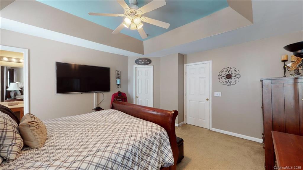 844 Dillard Road Rock Hill, SC 29730 - Photo 25 of 33 a bedroom with a bed and a flat screen tv
