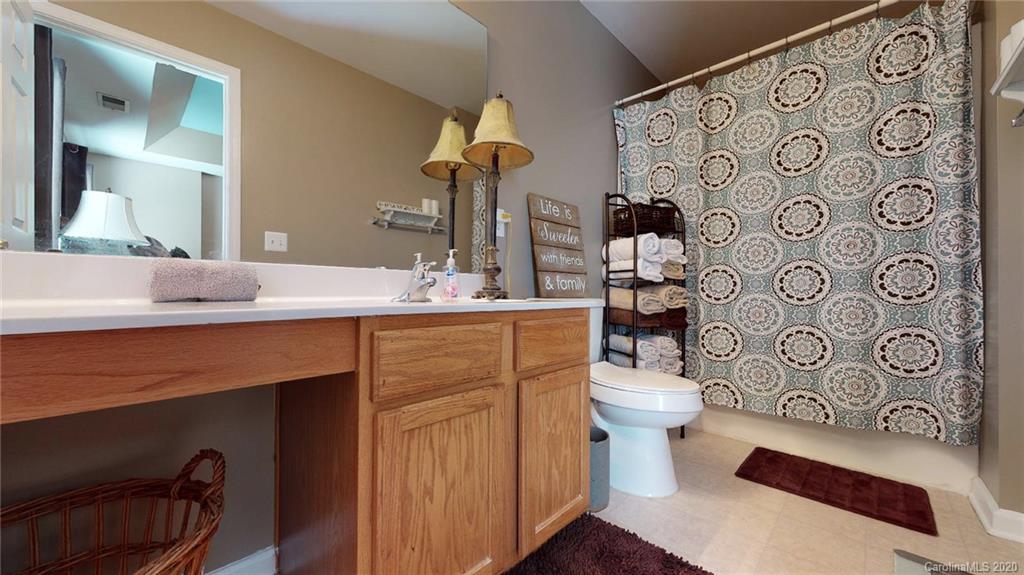 844 Dillard Road Rock Hill, SC 29730 - Photo 26 of 33 a bathroom with a sink toilet and shower