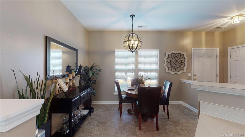 844 Dillard Road Rock Hill, SC 29730 - Photo 5 of 33 a view of a dining room with furniture and a chandelier