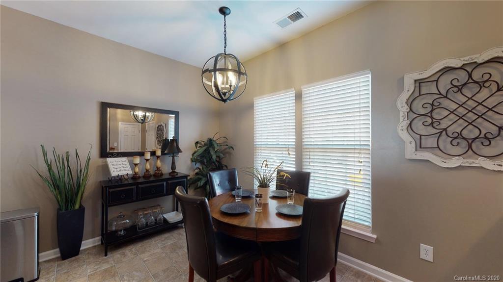 844 Dillard Road Rock Hill, SC 29730 - Photo 10 of 33 a view of a dining room with furniture and chandelier
