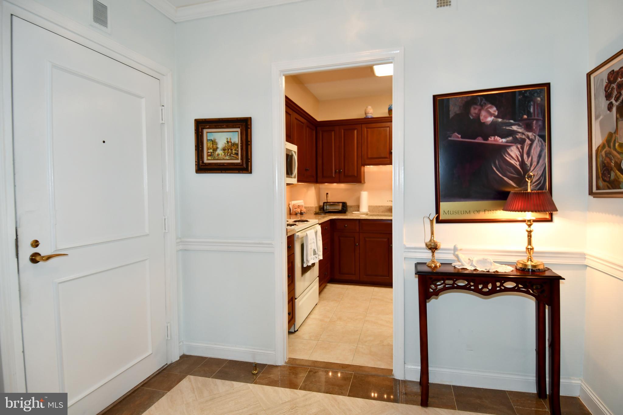 1250 South Washington Street, Unit 816 Alexandria, VA 22314 - Photo 11 of 58 a view of walk in closet with living room