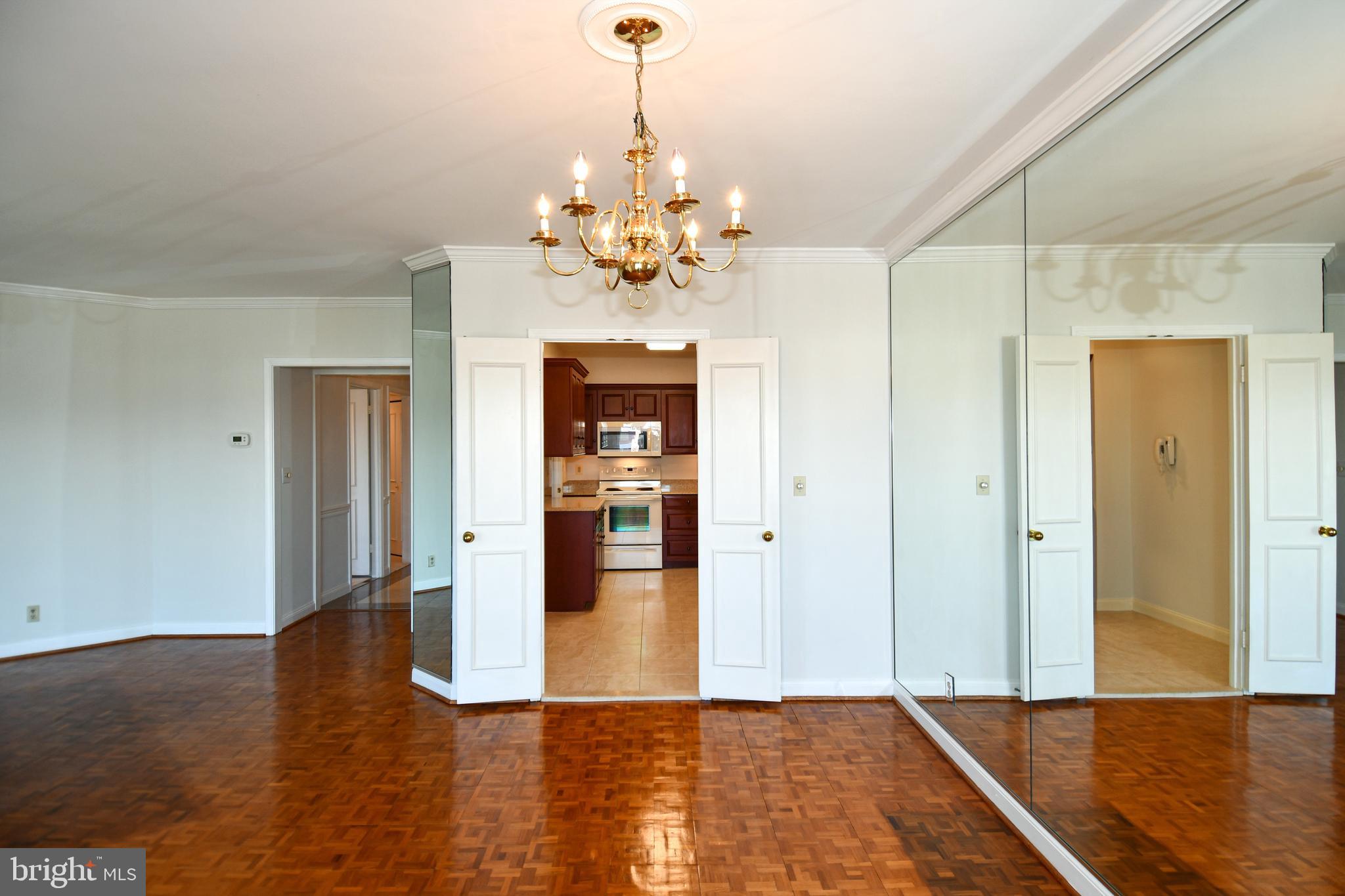 1250 South Washington Street, Unit 816 Alexandria, VA 22314 - Photo 14 of 58 a view of an empty room with window and wooden floor