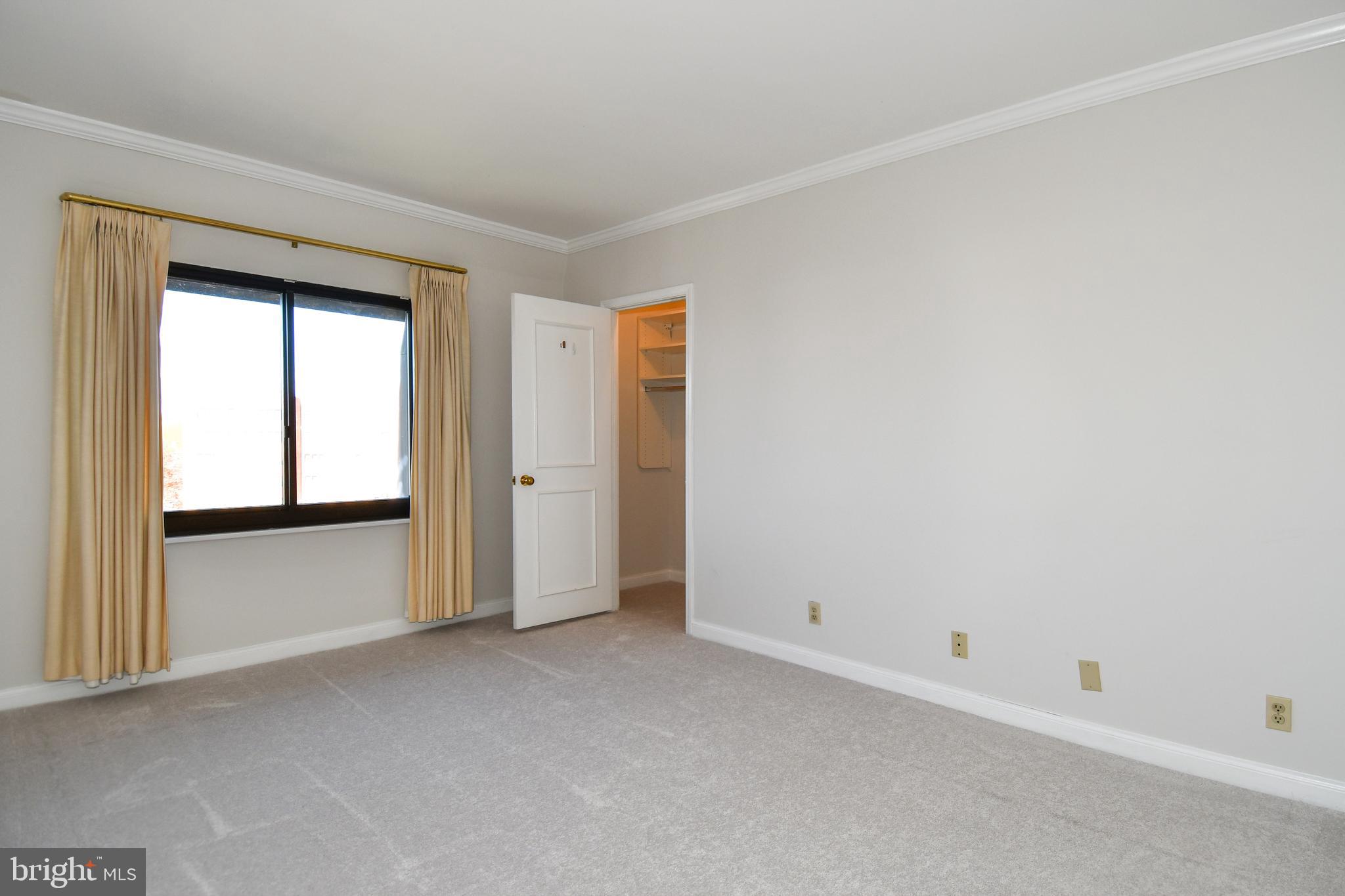 1250 South Washington Street, Unit 816 Alexandria, VA 22314 - Photo 20 of 58 an empty room with windows