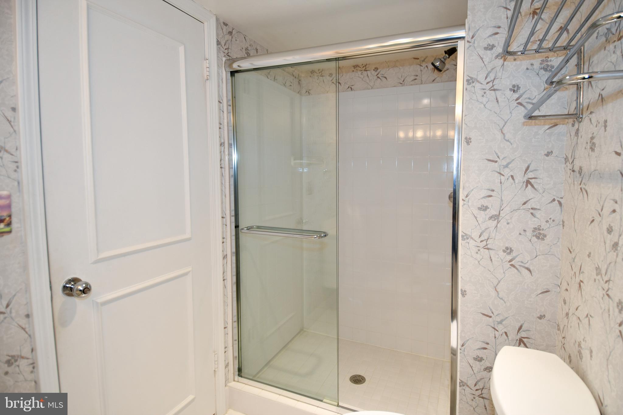 1250 South Washington Street, Unit 816 Alexandria, VA 22314 - Photo 29 of 58 a bathroom with a shower and a toilet